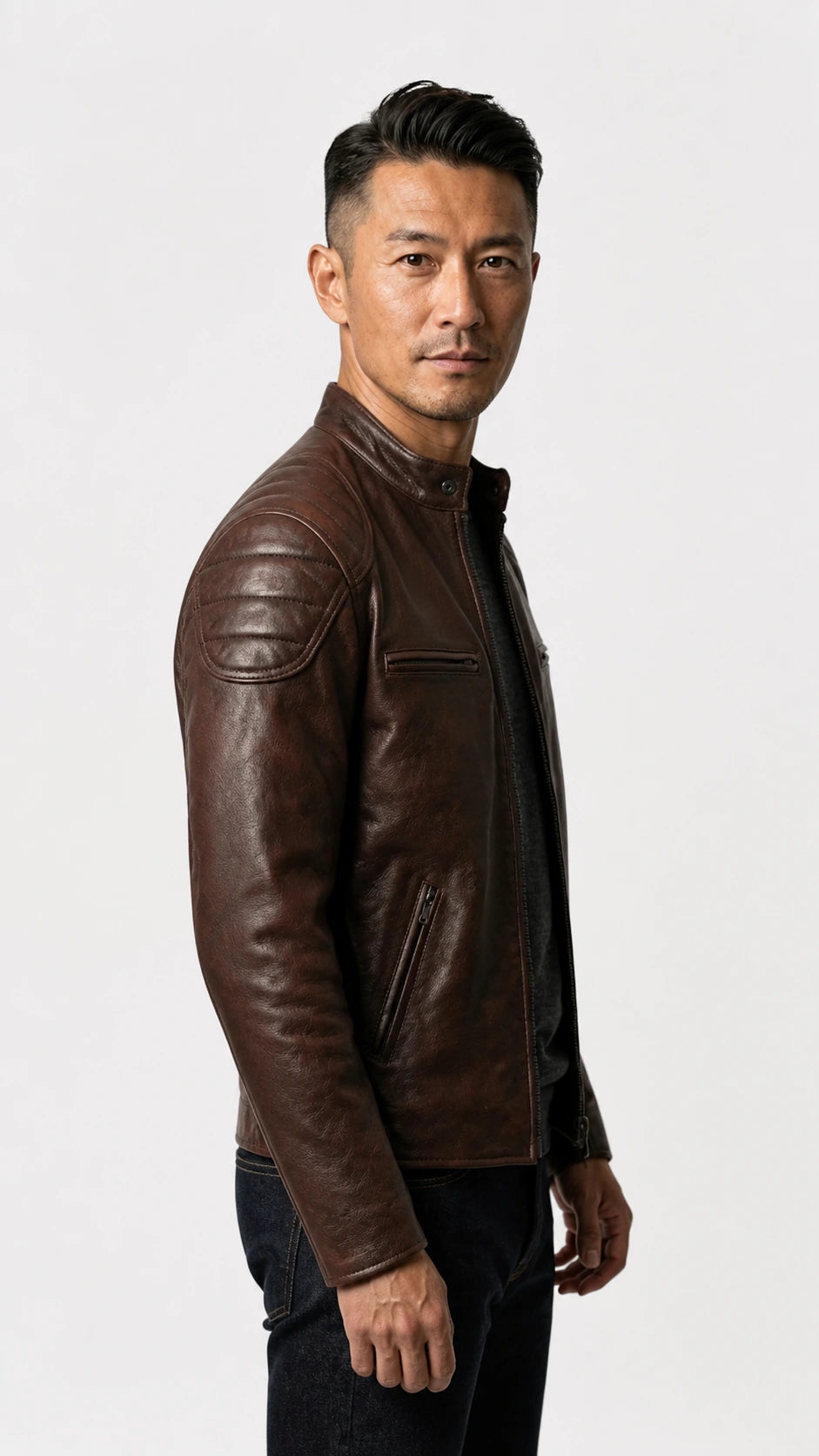 Side profile of a man wearing the vintage brown biker jacket