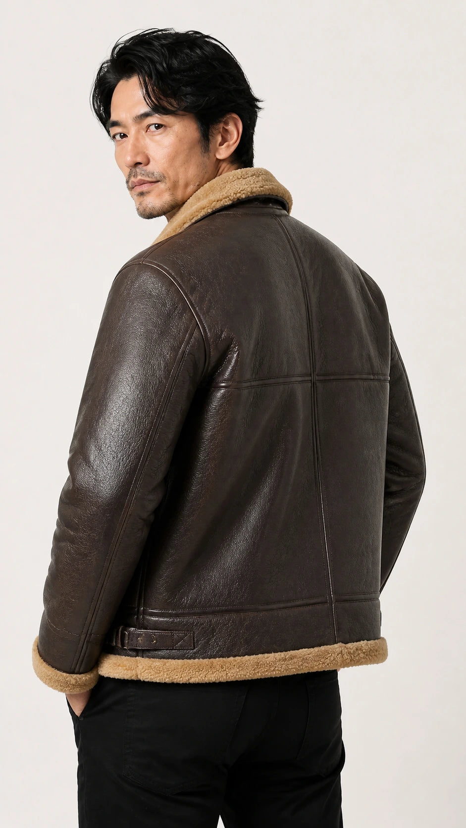 Back view of a man wearing the brown shearling B-3 jacket