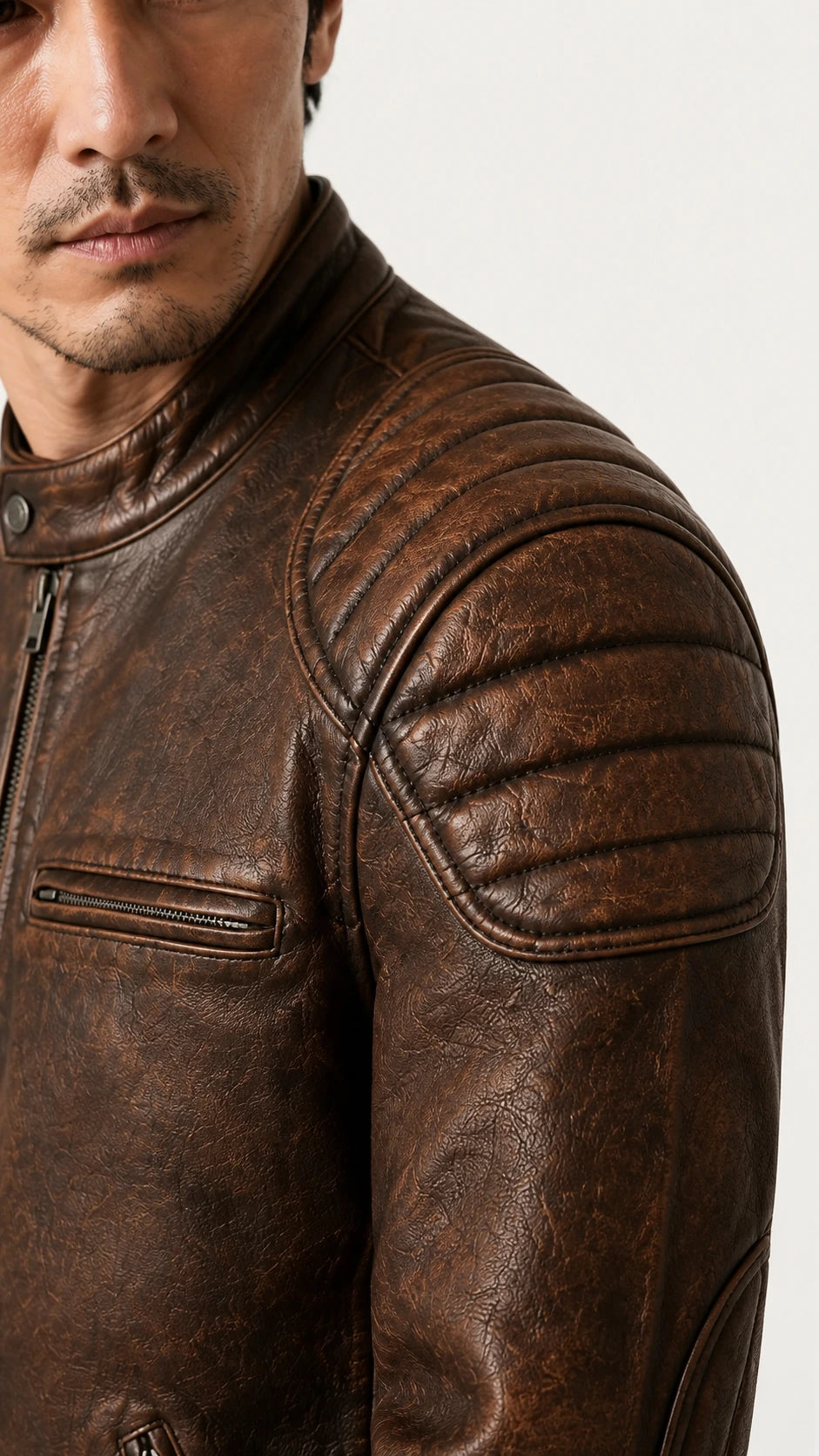 Close-up of the quilted shoulder panel and mottled brown cowhide