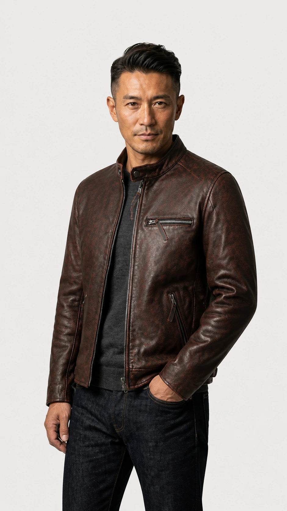 Man standing with hands in pockets in the oxblood cafe racer jacket