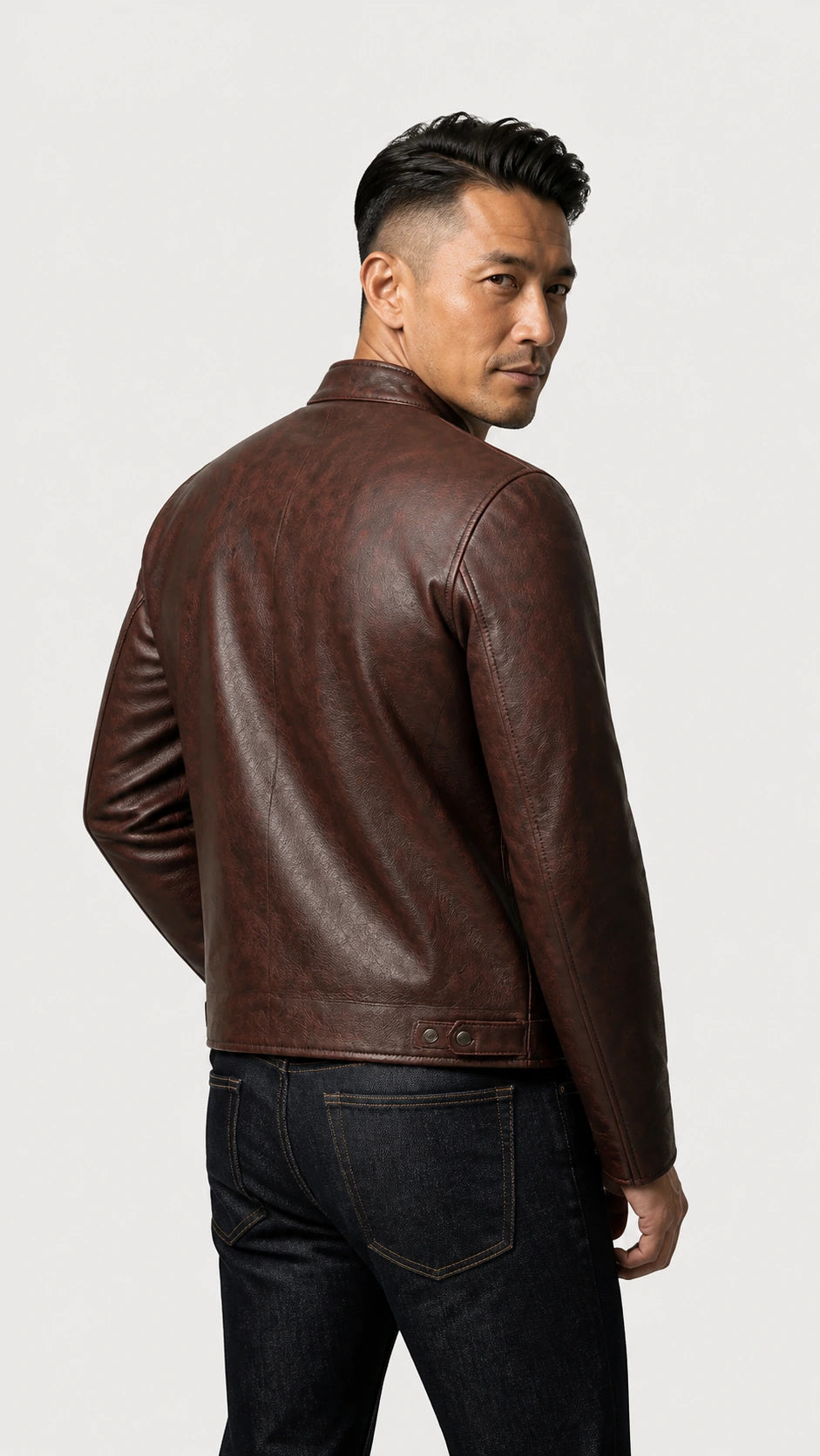 Back view of a man in the oxblood cafe racer jacket with dark jeans