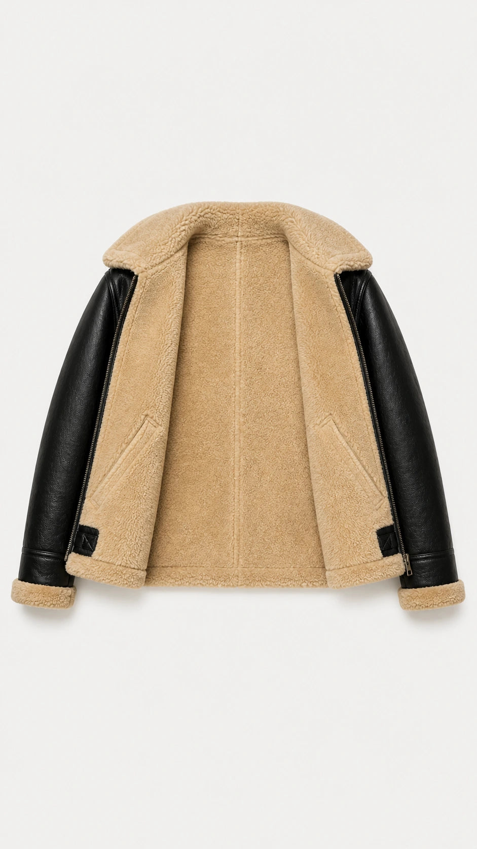 Black B-3 jacket opened flat to show the full cream shearling interior